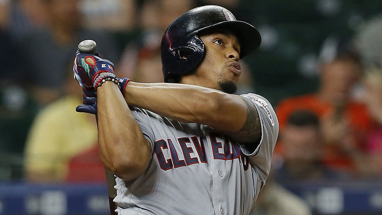 HOUSTON, TEXAS - APRIL 26: Francisco Lindor #12 of the Cleveland Indians hits a home run in the third inning as Robinson Chirinos #28 of the Houston Astros watches the ball leave the park at Minute Maid Park on April 26, 2019 in Houston, Texas.
