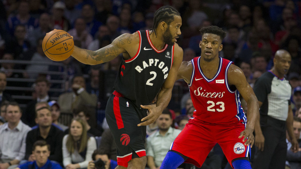 PHILADELPHIA, PA - FEBRUARY 05: Kawhi Leonard #2 of the Toronto Raptors controls the ball against Jimmy Butler #23 of the Philadelphia 76ers at the Wells Fargo Center on February 5, 2019 in Philadelphia, Pennsylvania. The Raptors defeated the 76ers 119-107.