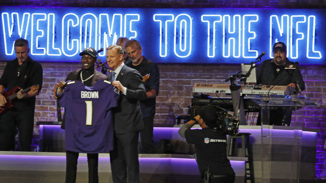 NASHVILLE, TENNESSEE - APRIL 25: Wide receiver Marquise Brown poses with NFL Commissioner Roger Goodell after being selected by Baltimore Ravens with pick 25 on day 1 of the 2019 NFL Draft on April 25, 2019 in Nashville, Tennessee.