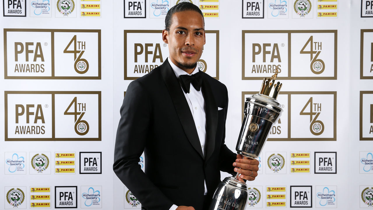 Liverpool's Virgil van Dijk poses with his PFA Player of the Year award during the 2019 PFA Awards at the Grosvenor House Hotel, London.
