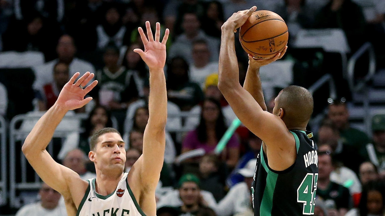 MILWAUKEE, WISCONSIN - APRIL 28: Al Horford #42 of the Boston Celtics attempts a shot while being guarded by Brook Lopez #11 of the Milwaukee Bucks in the third quarter during Game One of Round Two of the 2019 NBA Playoffs at the Fiserv Forum on April 28, 2019 in Milwaukee, Wisconsin.