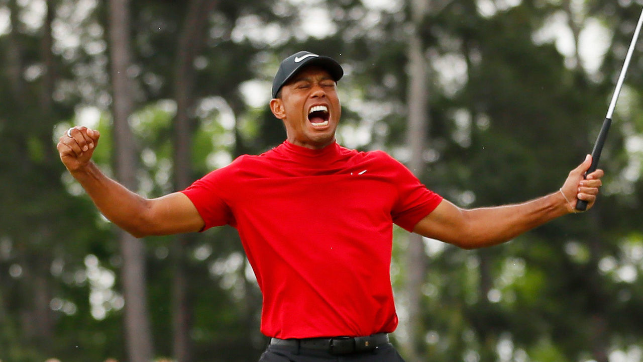 AUGUSTA, GEORGIA - APRIL 14: Tiger Woods of the United States celebrates after sinking his putt on the 18th green to win during the final round of the Masters at Augusta National Golf Club on April 14, 2019 in Augusta, Georgia.