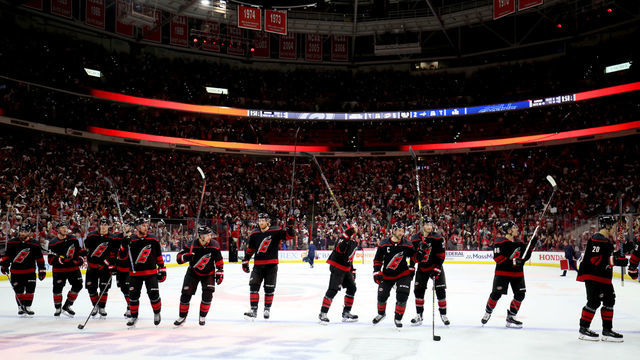 RALEIGH, NC - APRIL 22: The Carolina Hurricanes players salute fans after their win over the Washington Capitals in Game Six of the Eastern Conference First Round during the 2019 NHL Stanley Cup Playoffs on April 22, 2019 at PNC Arena in Raleigh, North Carolina.
