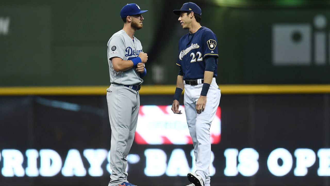 MILWAUKEE, WISCONSIN - APRIL 18: Cody Bellinger #35 of the Los Angeles Dodgers and Christian Yelich #22 of the Milwaukee Brewers talk prior to a game at Miller Park on April 18, 2019 in Milwaukee, Wisconsin.