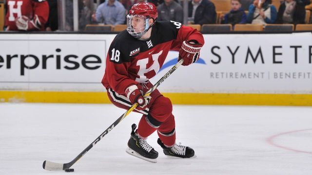 BOSTON, MA - FEBRUARY 4: Harvard Crimson defenseman Adam Fox (18) looks up ice for an open teammate. During the Harvard Crimson game against the Boston College Eagles on February 4, 2019 at TD Garden in Boston, MA.