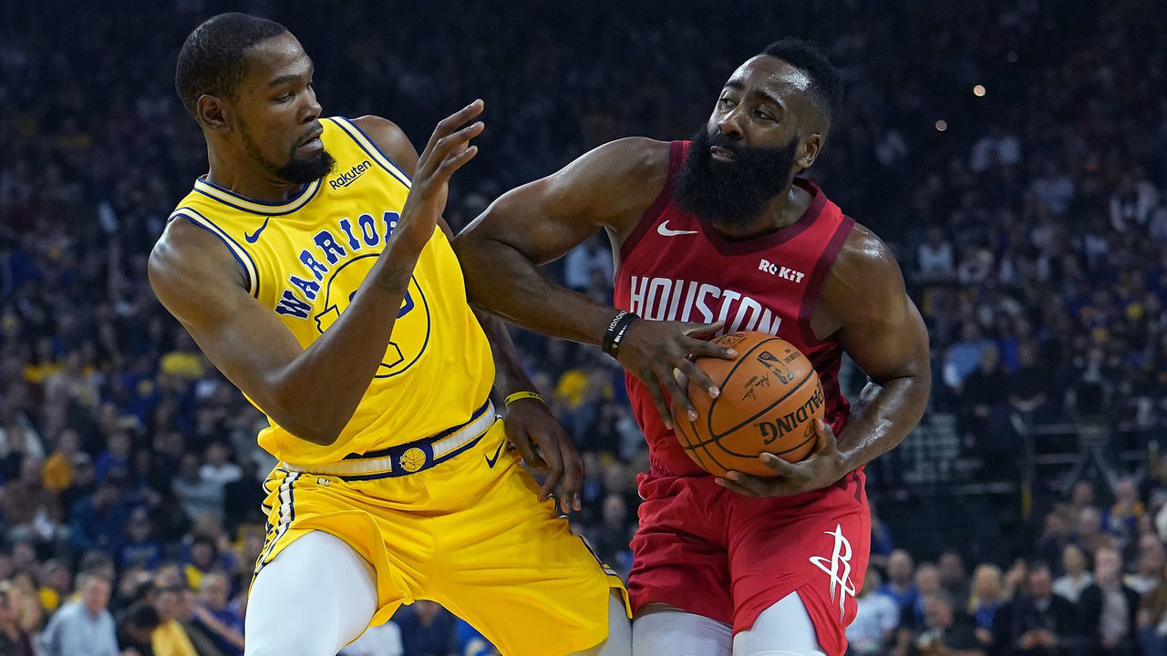 OAKLAND, CA - JANUARY 03: James Harden #13 of the Houston Rockets drives towards the basket on Kevin Durant #35 of the Golden State Warriors during an NBA basketball game at ORACLE Arena on January 3, 2019 in Oakland, California.
