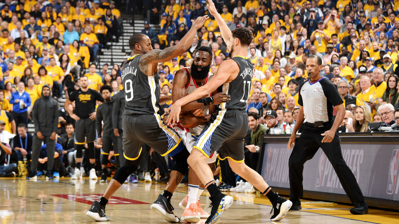 OAKLAND, CA - APRIL 30: Andre Iguodala #9 and Klay Thompson #11 of the Golden State Warriors defend against James Harden #13 of the Houston Rockets during Game Two of the Western Conference Semi-Finals of the 2019 NBA Playoffs on April 30, 2019 at ORACLE Arena in Oakland, California. NOTE TO USER: User expressly acknowledges and agrees that, by downloading and or using this photograph, user is consenting to the terms and conditions of Getty Images License Agreement. Mandatory Copyright Notice: Copyright 2019 NBAE