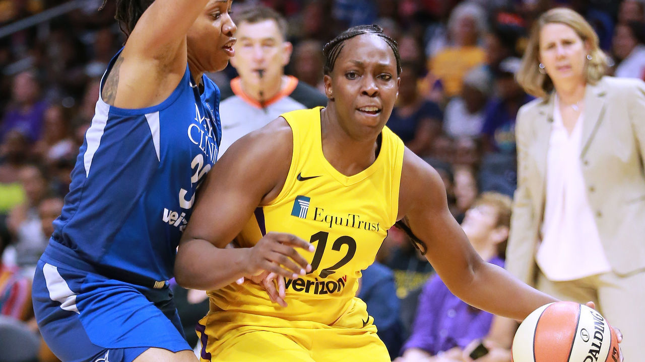 LOS ANGELES, CA - AUGUST 21: Chelsea Gray #12 of the Los Angeles Sparks handles the ball against Tanisha Wright #30 of the Minnesota Lynx in Round One of the 2018 WNBA Playoffs at Staples Center on August 21, 2018 in Los Angeles, California.