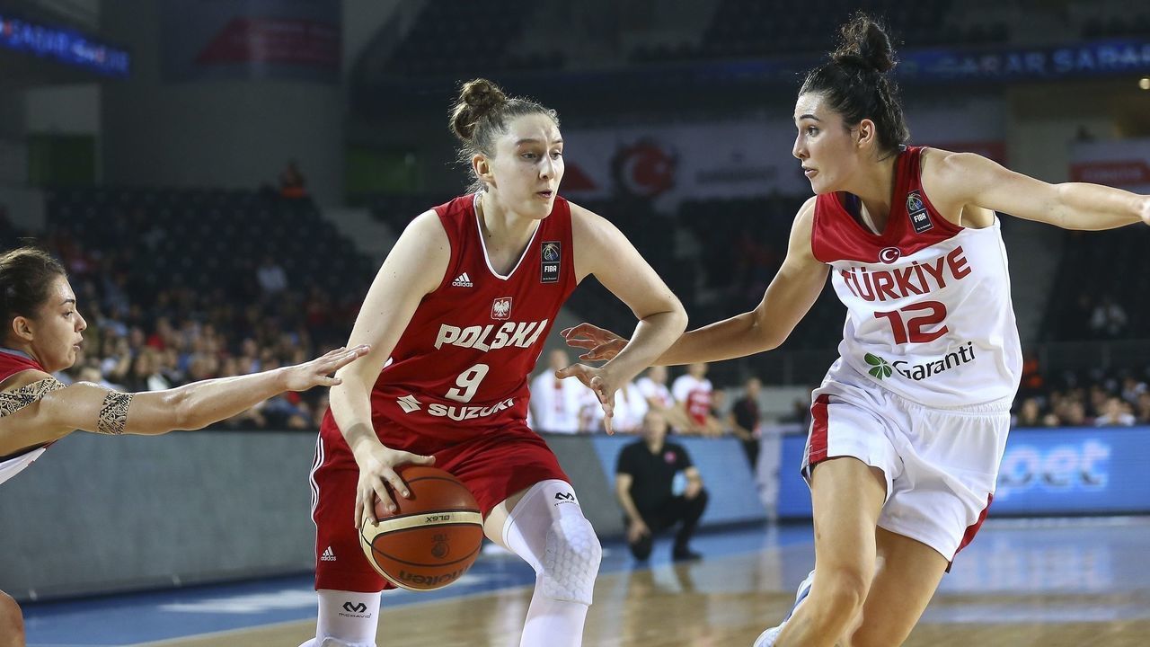 ANKARA, TURKEY - NOVEMBER 15: Anna Makurat (C) of Poland in action against Pelin Bilgic (L) and Tugce Canitez (R) of Turkey during the 2019 Women FIBA EuroBasket Qualification Group B match between Turkey and Poland at Ankara Sports Hall in Ankara, Turkey on November 15, 2017.