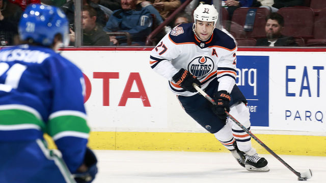 VANCOUVER, BC - JANUARY 16: Milan Lucic #27 of the Edmonton Oilers skates up ice with the puck during their NHL game against the Vancouver Canucks at Rogers Arena January 16, 2019 in Vancouver, British Columbia, Canada. "n