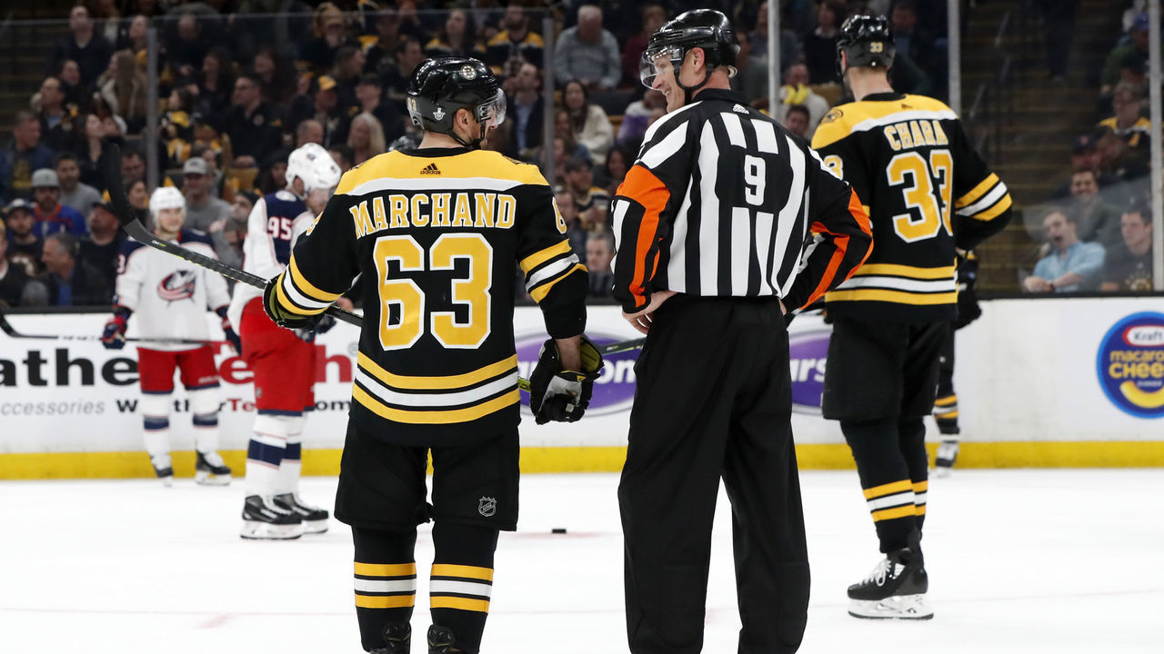 BOSTON, MA - APRIL 25: Boston Bruins left wing Brad Marchand (63) and referee Dan O'Rourke (9) chat during Game 1 of the Second Round 2019 Stanley Cup Playoffs between the Boston Bruins and the Columbus Blue Jackets on April 25, 2019, at TD Garden in Boston, Massachusetts.