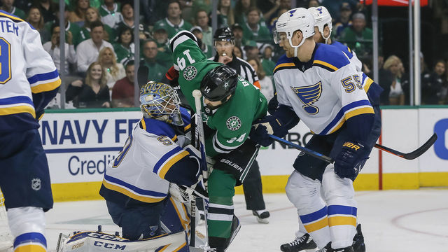 DALLAS, TX - MAY 01: St. Louis Blues goaltender Jordan Binnington (50) and Dallas Stars left wing Jamie Benn (14) collide during the game between the Dallas Stars and the St. Louis Blues on May 01, 2019 at the American Airlines Center in Dallas, Texas.