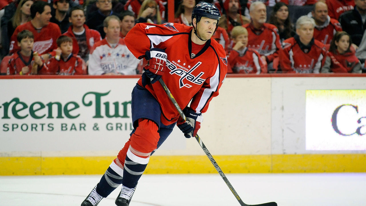 WASHINGTON, DC - FEBRUARY 02: John Erskine #4 of the Washington Capitals skates down the ice against the Detroit Red Wings at Verizon Center on February 2, 2014 in Washington, DC.