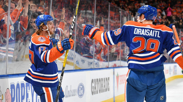 EDMONTON, AB - DECEMBER 9: Connor McDavid #97 and Leon Draisaitl #29 of the Edmonton Oilers celebrate after a goal during the game against the Calgary Flames on December 9, 2018 at Rogers Place in Edmonton, Alberta, Canada.