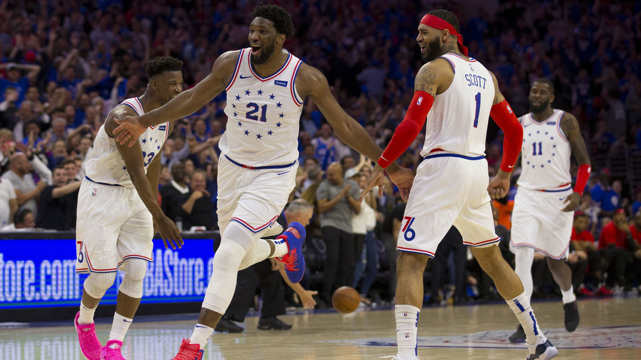 PHILADELPHIA, PA - MAY 02: Joel Embiid #21 of the Philadelphia 76ers reacts along with Jimmy Butler #23, Mike Scott #1, and James Ennis III #11 after dunking the ball against the Toronto Raptors in the fourth quarter of Game Three of the Eastern Conference Semifinals at the Wells Fargo Center on May 2, 2019 in Philadelphia, Pennsylvania. The 76ers defeated the Raptors 116-95.
