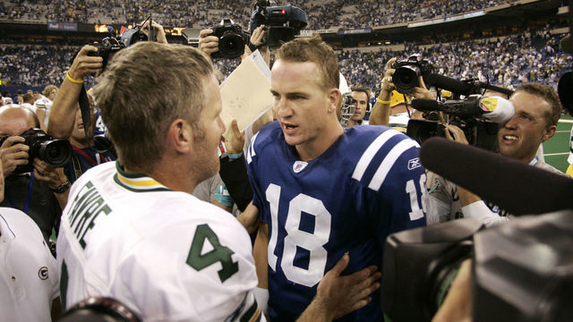 Quarterback icons Brett Favre and Peyton Manning meet after a much hyped and highly anticipated offensive showdown at the RCA Dome.