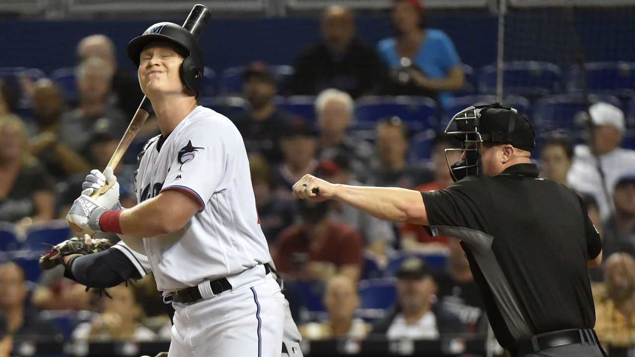 MIAMI, FL - APRIL 30: Garrett Cooper #26 of the Miami Marlins reacts after striking out in the second inning against the Cleveland Indians at Marlins Park on April 30, 2019 in Miami, Florida.