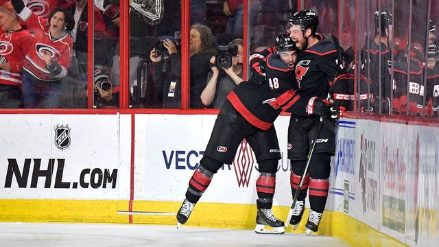 RALEIGH, NORTH CAROLINA - MAY 03: Greg McKegg #42 celebrates with Jordan Martinook #48 of the Carolina Hurricanes after scoring against the New York Islanders in the second period of Game Four of the Eastern Conference Second Round during the 2019 NHL Stanley Cup Playoffs at PNC Arena on May 03, 2019 in Raleigh, North Carolina.
