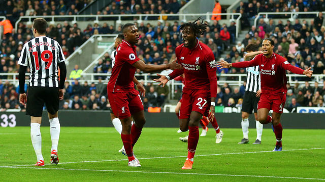 NEWCASTLE UPON TYNE, ENGLAND - MAY 04: Divock Origi of Liverpool celebrates after scoring a goal to make it 2-3 during the Premier League match between Newcastle United and Liverpool FC at St. James Park on May 4, 2019 in Newcastle upon Tyne, United Kingdom.