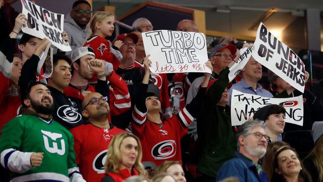 RALEIGH, NC - FEBRUARY 26: Fans of the Carolina Hurricanes show off "Bunch of Jerks" signage during a game against the Los Angeles Kings during an NHL game on February 26, 2019 at PNC Arena in Raleigh, North Carolina.