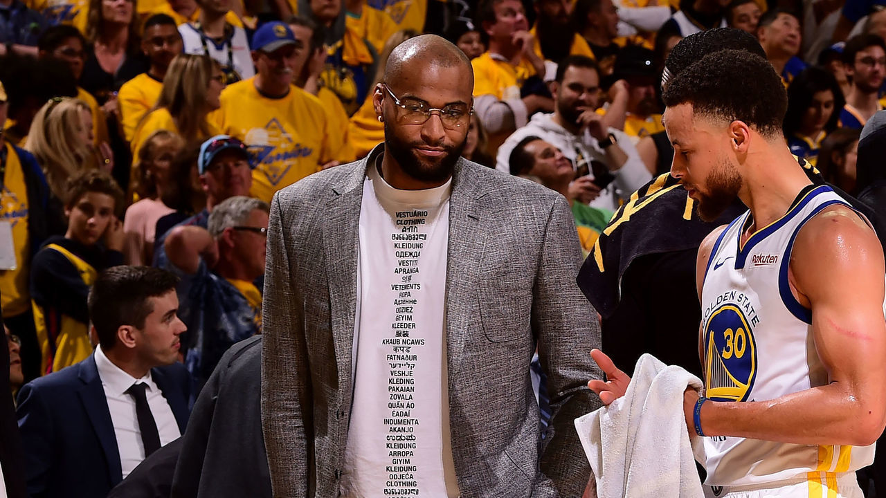 OAKLAND, CA - APRIL 28: DeMarcus Cousins #0, and Stephen Curry #30 of the Golden State Warriors talk after Game One of the Western Conference Semifinals of the 2019 NBA Playoffs against the Houston Rockets on April 28, 2019 at ORACLE Arena in Oakland, California. Mandatory Copyright Notice: Copyright 2019 NBAE