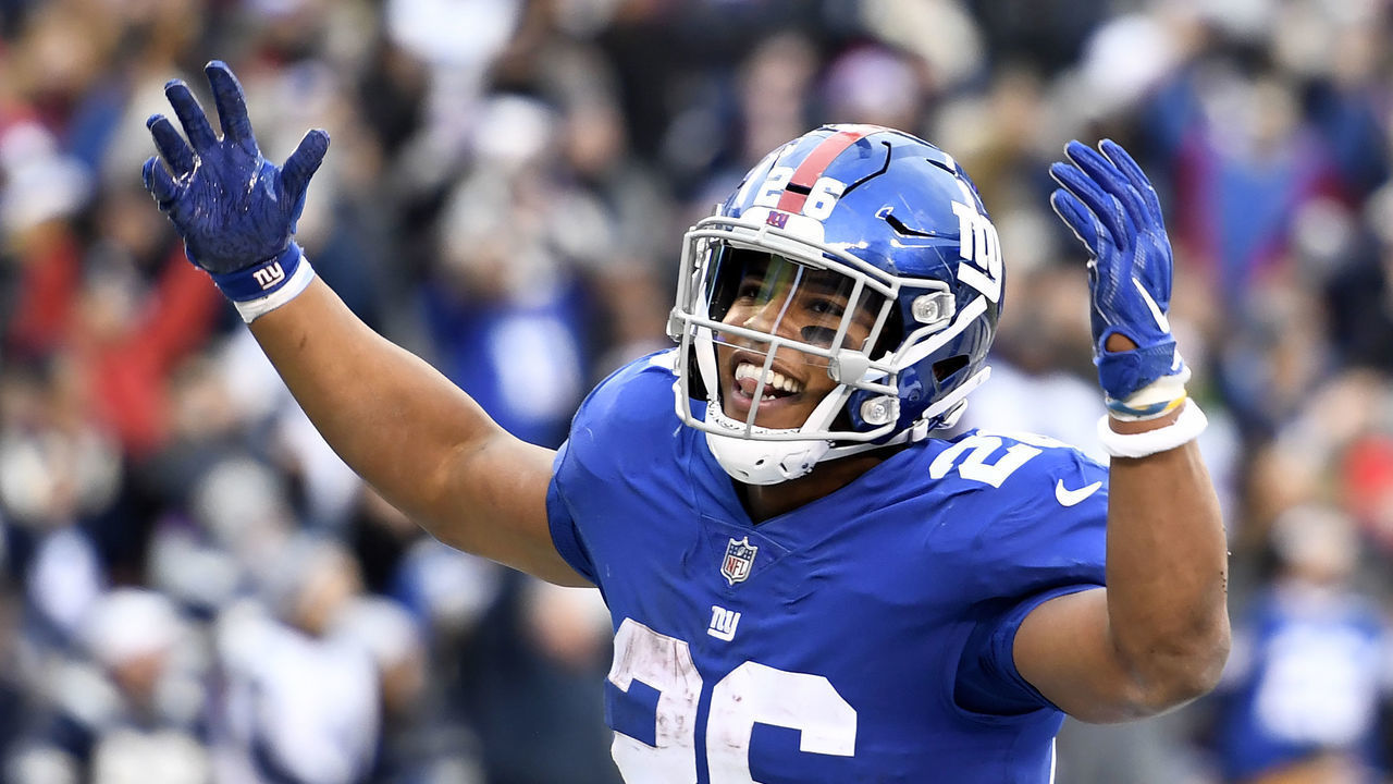 EAST RUTHERFORD, NEW JERSEY - DECEMBER 30: Saquon Barkley #26 of the New York Giants reacts after scoring during the fourth quarter of the game against the Dallas Cowboys at MetLife Stadium on December 30, 2018 in East Rutherford, New Jersey.