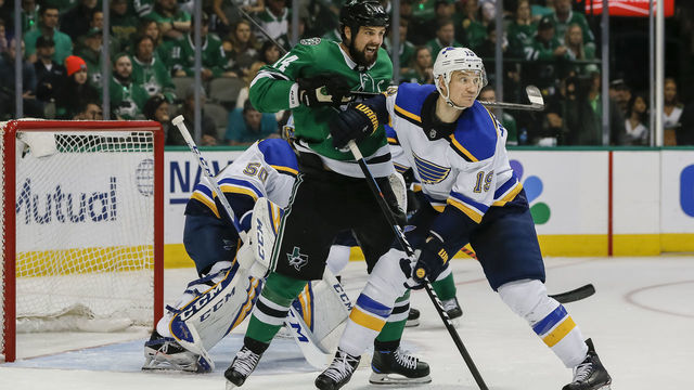 DALLAS, TX - MAY 05: Dallas Stars left wing Jamie Benn (14) and St. Louis Blues defenseman Jay Bouwmeester (19) battle for position in front of St. Louis Blues goaltender Jordan Binnington (50) during the game between the Dallas Stars and the St. Louis Blues on May 5, 2019 at the American Airlines Center in Dallas, Texas.