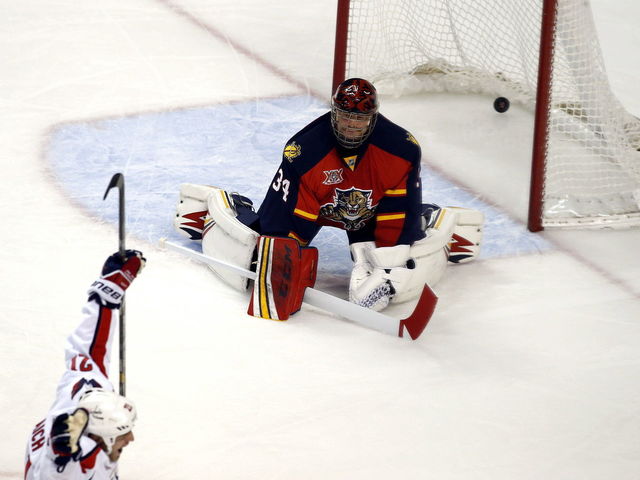 GIF: Tim Thomas falls down during Mike Green breakaway, still makes the save