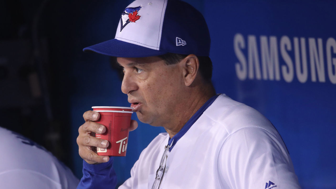 TORONTO, ON - APRIL 23: Manager Charlie Montoyo #25 of the Toronto Blue Jays drinks a Tim Hortons coffee in the dugout shortly before the start of MLB game action against the San Francisco Giants Rogers Centre on April 23, 2019 in Toronto, Canada.