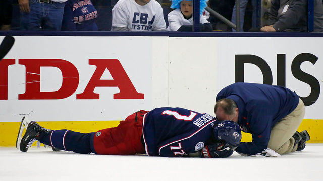 COLUMBUS, OH - MAY 6: Head athletic trainer Mike Vogt checks on Josh Anderson #77 after being hit in the head by Charlie McAvoy #73 of the Boston Bruins during the second period in Game Six of the Eastern Conference Second Round during the 2019 NHL Stanley Cup Playoffs on May 6, 2019 at Nationwide Arena in Columbus, Ohio.