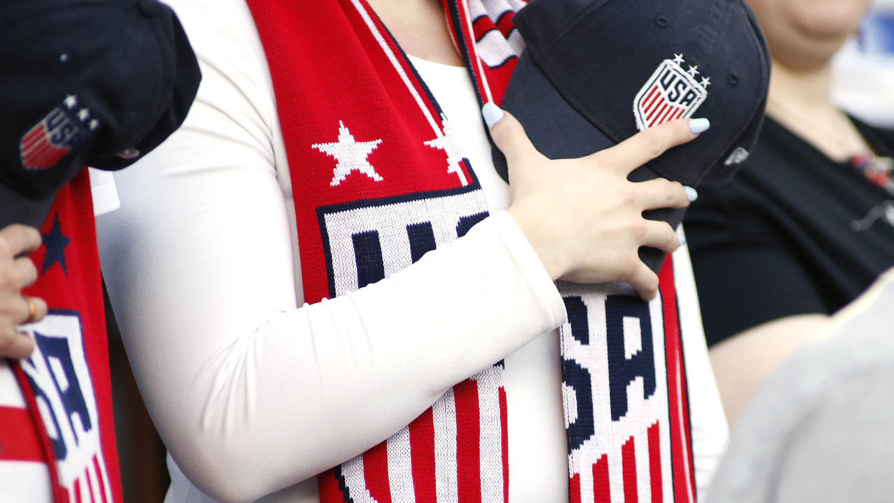 LOS ANGELES, CALIFORNIA - APRIL 07: A fan of the United States Women's National Team observes the national anthem ahead of a game between the United States Women's National Team and the Belgian Women's National Team at Banc of California Stadium on April 07, 2019 in Los Angeles, California.