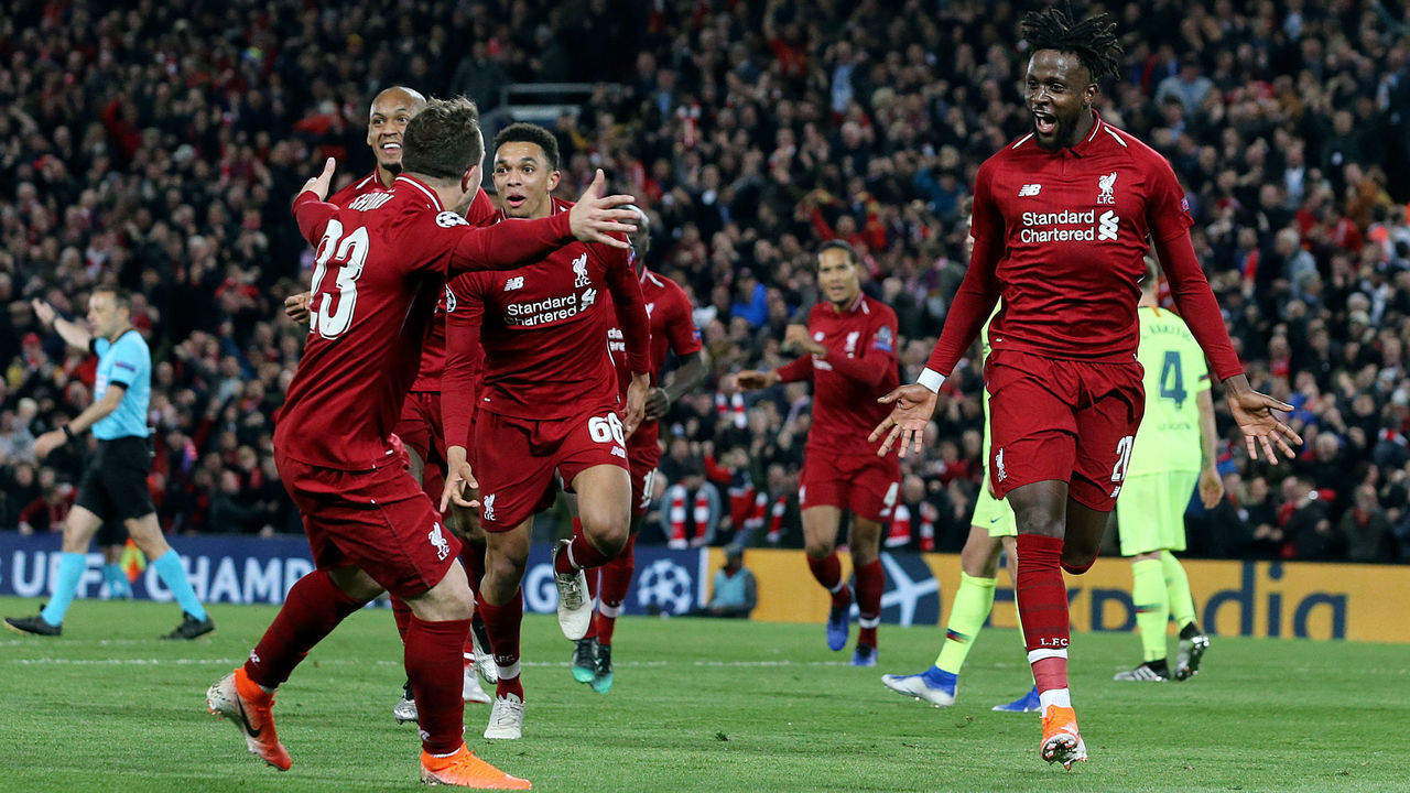 LIVERPOOL, ENGLAND - MAY 07: Liverpool's Divock Origi (right) celebrates scoring his side's fourth goal during the UEFA Champions League Semi Final second leg match between Liverpool and Barcelona at Anfield on May 7, 2019 in Liverpool, England.