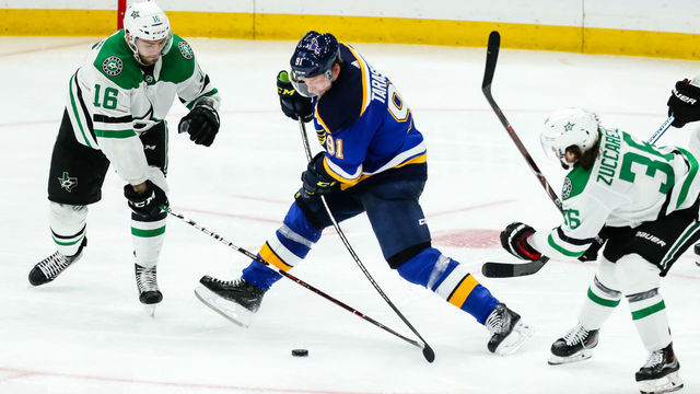 ST. LOUIS, MO - MAY 7: St. Louis Blues' Vladimir Tarasenko, center, battles for the puck against Dallas Stars' Jason Dickinson, left, and Mats Zuccarello, right, during the third period of Game 7 of an NHL Western Conference second-round hockey playoff series between the St. Louis Blues and the Dallas Stars on May 7, 2019, at the Enterprise Center in St. Louis, MO.