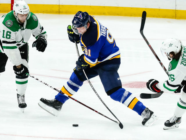 ST. LOUIS, MO - MAY 7: St. Louis Blues' Vladimir Tarasenko, center, battles for the puck against Dallas Stars' Jason Dickinson, left, and Mats Zuccarello, right, during the third period of Game 7 of an NHL Western Conference second-round hockey playoff series between the St. Louis Blues and the Dallas Stars on May 7, 2019, at the Enterprise Center in St. Louis, MO.