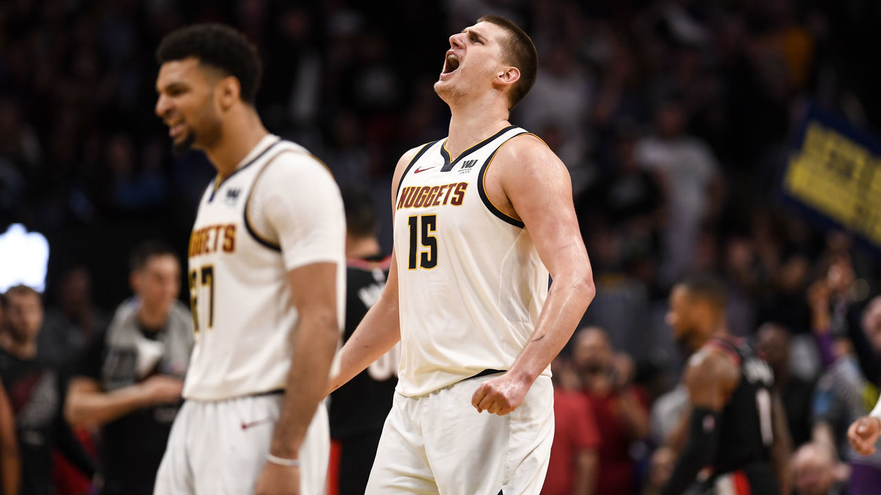 DENVER, CO - MAY 7: Nikola Jokic (15) of the Denver Nuggets and Jamal Murray (27) get hyped after a Gary Harris (14) score against the Portland Trail Blazers to really push the momentum in their favor during the second quarter on Tuesday, May 7, 2019. The Denver Nuggets versus the Portland Trail Blazers in game five of the teams' second round NBA playoff series at the Pepsi Center in Denver.