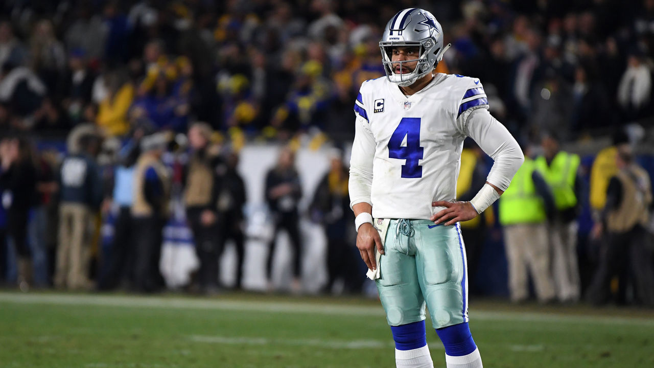 LOS ANGELES, CA - JANUARY 12: Dak Prescott #4 of the Dallas Cowboys looks on in the second half against the Los Angels Rams in the NFC Divisional Playoff game at Los Angeles Memorial Coliseum on January 12, 2019 in Los Angeles, California.