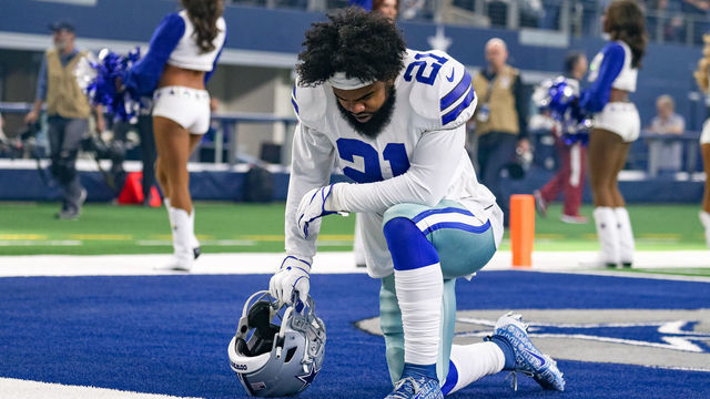 ARLINGTON, TX - DECEMBER 09: Dallas Cowboys Running Back Ezekiel Elliott (21) prays prior to the game between the Philadelphia Eagles and Dallas Cowboys on December 9, 2018 at AT&T Stadium in Arlington, TX.