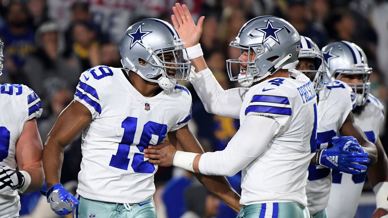 LOS ANGELES, CA - JANUARY 12: Amari Cooper #19 of the Dallas Cowboys celebrates a 29 yard touchdown pass from Dak Prescott #4 in the first quarter against the Los Angeles Rams in the NFC Divisional Playoff game at Los Angeles Memorial Coliseum on January 12, 2019 in Los Angeles, California.