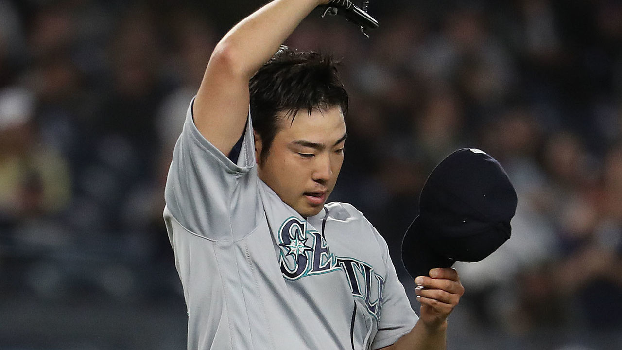 NEW YORK, NEW YORK - MAY 08: Yusei Kikuchi #18 of the Seattle Mariners reacts after giving up a hit in the sixth inning by Mike Tauchman #39 of the New York Yankees during their game at Yankee Stadium on May 08, 2019 in New York City.