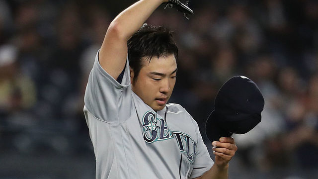 NEW YORK, NEW YORK - MAY 08: Yusei Kikuchi #18 of the Seattle Mariners reacts after giving up a hit in the sixth inning by Mike Tauchman #39 of the New York Yankees during their game at Yankee Stadium on May 08, 2019 in New York City.