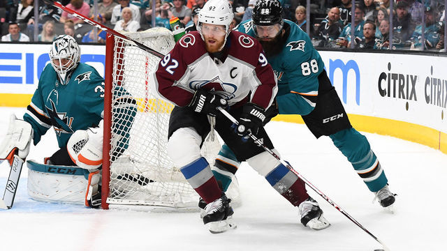 SAN JOSE, CA - MAY 08: Gabriel Landeskog #92 of the Colorado Avalanche skates from behind the goal with the puck pursued by Brent Burns #88 of the San Jose Sharks during the first period in Game Seven of the Western Conference Second Round during the 2019 NHL Stanley Cup Playoffs at SAP Center on May 8, 2019 in San Jose, California.