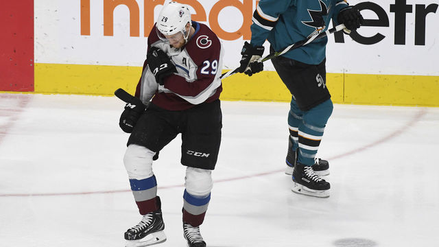 SAN JOSE, C0 - MAY 08: Colorado Avalanche center Nathan MacKinnon (29) grimaces in pain grabbing his right shoulder in the first period at the SAP Center during game seven of the Stanley Cup Western Conference semifinals May 08, 2019. San Jose Sharks defenseman Justin Braun (61) skates past. MacKinnon came out the game, but retuned later in the first period.
