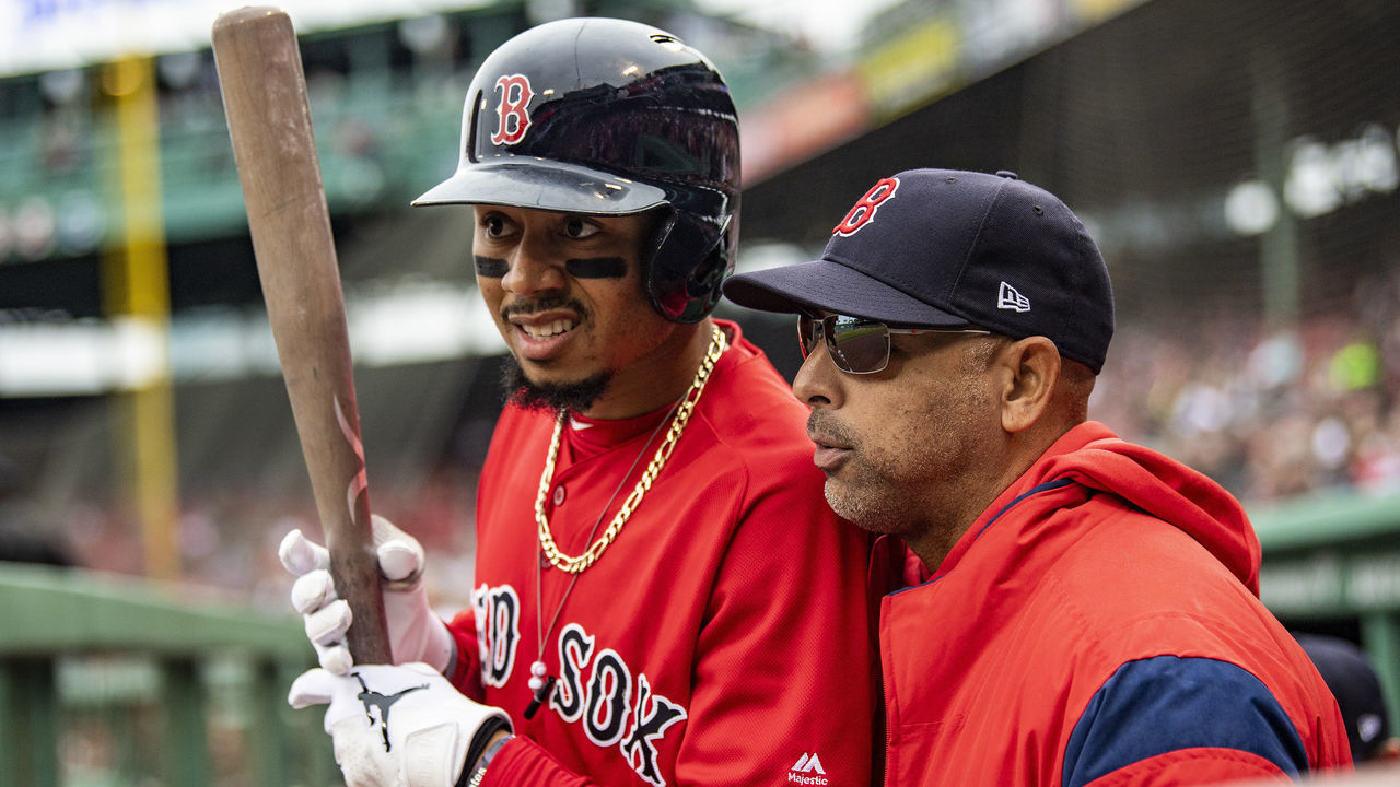 BOSTON, MA - APRIL 23: Mookie Betts #50 of the Boston Red Sox talks with manager Alex Cora during the first inning of game one of a doubleheader against the Detroit Tigers on April 23, 2019 at Fenway Park in Boston, Massachusetts.