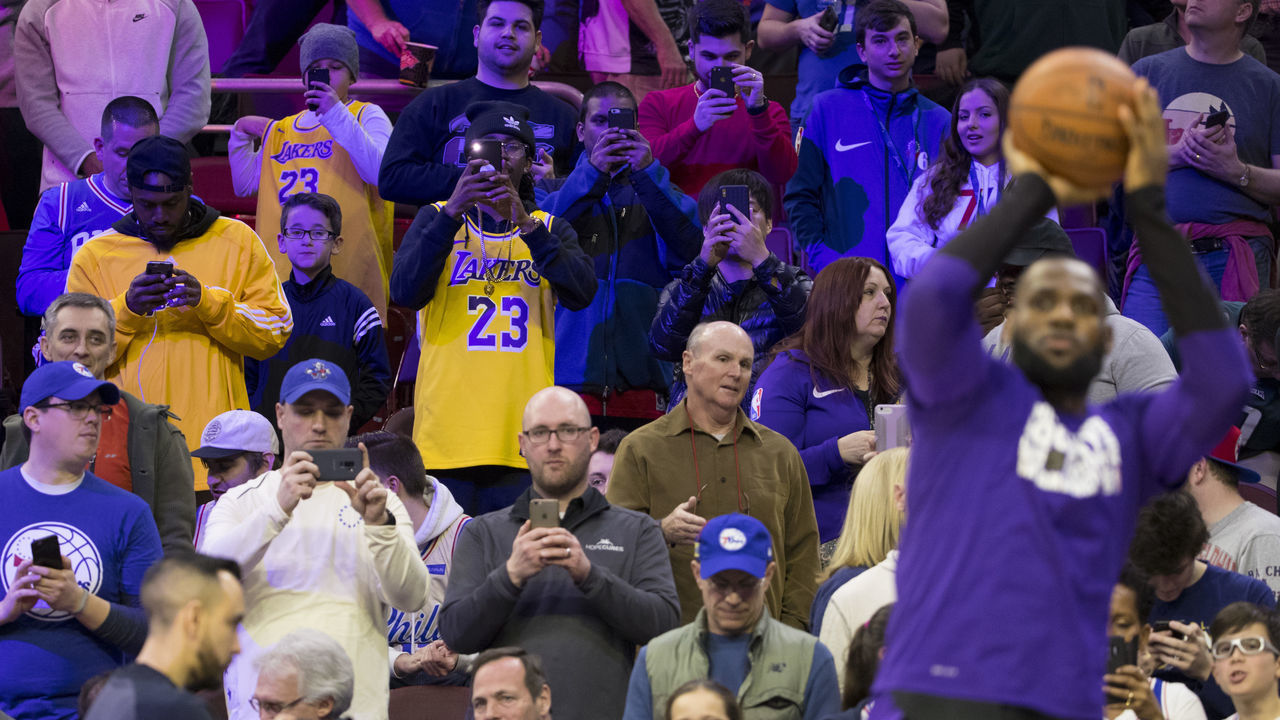 PHILADELPHIA, PA - FEBRUARY 10: Fans take photos of LeBron James #23 of the Los Angeles Lakers prior to the game against the Philadelphia 76ers at the Wells Fargo Center on February 10, 2019 in Philadelphia, Pennsylvania. The 76ers defeated the Laker 143-120.