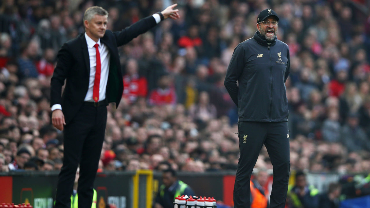 MANCHESTER, ENGLAND - FEBRUARY 24: Jurgen Klopp, Manager of Liverpool and Ole Gunnar Solskjaer, Interim Manager of Manchester United react during the Premier League match between Manchester United and Liverpool FC at Old Trafford on February 24, 2019 in Manchester, United Kingdom.