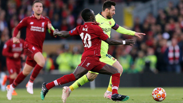 LIVERPOOL, ENGLAND - MAY 07: Barcelona's Lionel Messi under pressure from Liverpool's Sadio Mane during the UEFA Champions League Semi Final second leg match between Liverpool and Barcelona at Anfield on May 7, 2019 in Liverpool, England.