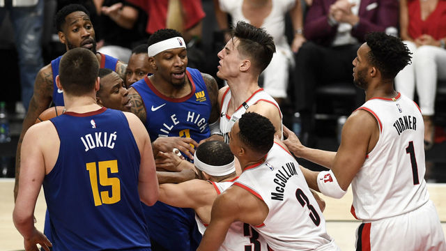 PORTLAND, OR - MAY 9: Seth Curry (31) of the Portland Trail Blazers and Will Barton (5) of the Denver Nuggets are separated as they jaw violently as Torrey Craig (3), Nikola Jokic (15), Evan Turner (1) and CJ McCollum (3) enter the scuffle during the fourth quarter of the Trail Blazers' 119-108 win on Thursday, May 9, 2019. The Portland Trail Blazers tied the series with the Denver Nuggets 3-3 with a game-six win in the teams' second round NBA playoff series at the Moda Center in Portland.