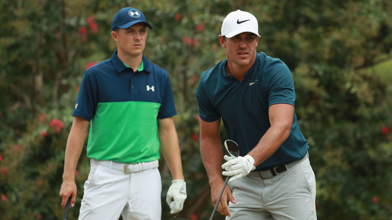 CHARLOTTE, NC - AUGUST 11: Brooks Koepka of the United States reacts to his tee shot on the second hole as Jordan Spieth of the United States looks on during the second round of the 2017 PGA Championship at Quail Hollow Club on August 11, 2017 in Charlotte, North Carolina.