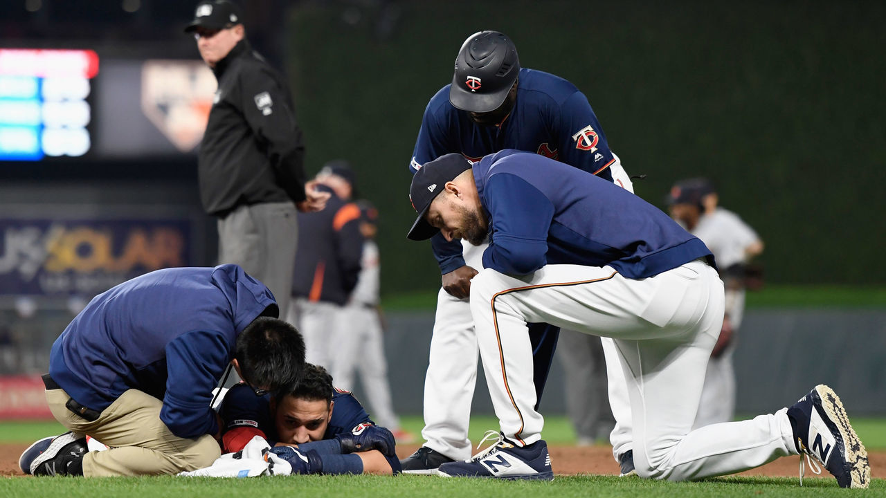 MINNEAPOLIS, MN - MAY 10: Marwin Gonzalez #9 of the Minnesota Twins is checked on by trainer Masa Abe, manager Rocco Baldelli #5 and first base coach Tommy Watkins #40 after a collision with Niko Goodrum #28 of the Detroit Tigers at first base during the sixth inning of the game on May 10, 2019 at Target Field in Minneapolis, Minnesota. Both Gonzalez and Goodrum were injured on the play and left the game. The Twins defeated the Tigers 6-0.