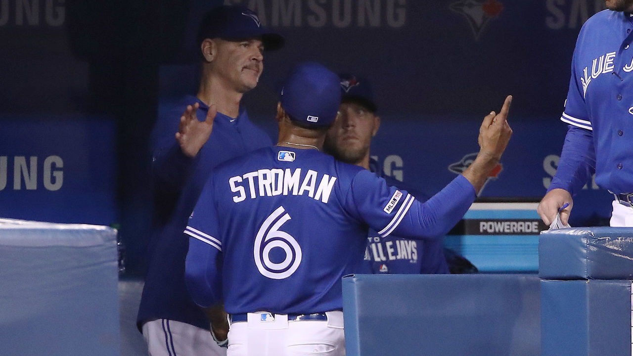 TORONTO, ON - MAY 11: Pitching coach Pete Walker #40 of the Toronto Blue Jays tries to soothe Marcus Stroman #6 who reacts as he is taken out of the game in the seventh inning during MLB game action against the Chicago White Sox at Rogers Centre on May 11, 2019 in Toronto, Canada.